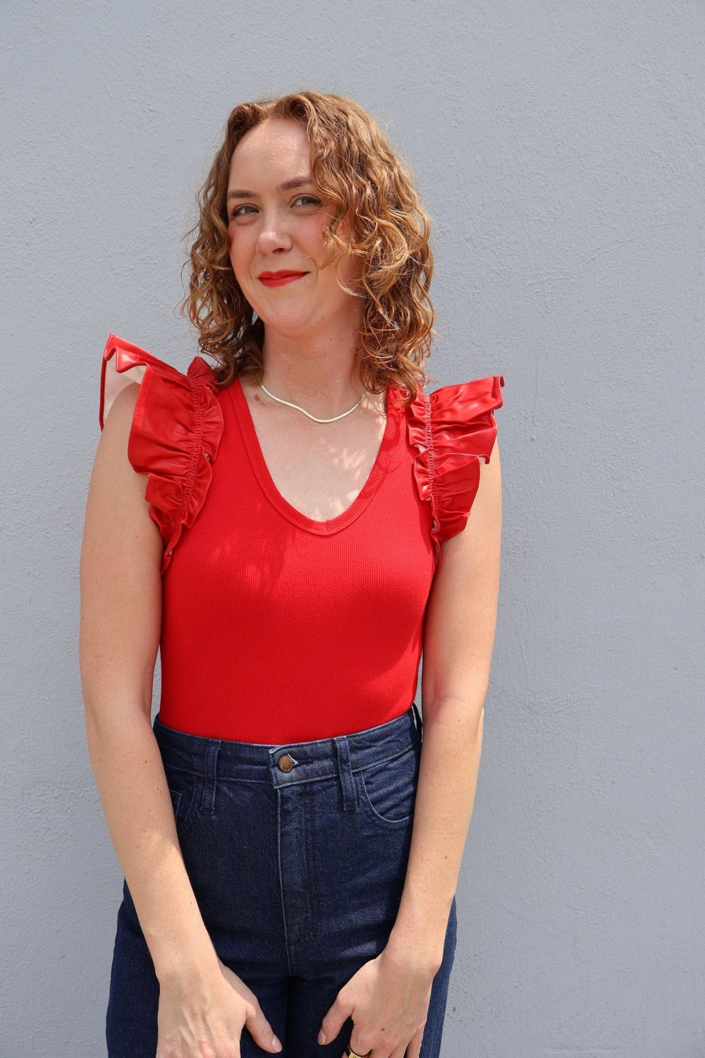 V - neck bodysuit with faux leather ruffle sleeves - The Color Collab