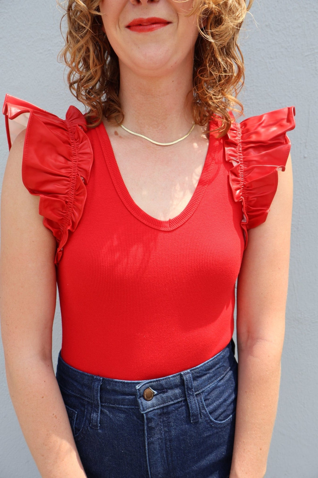 V - neck bodysuit with faux leather ruffle sleeves - The Color Collab